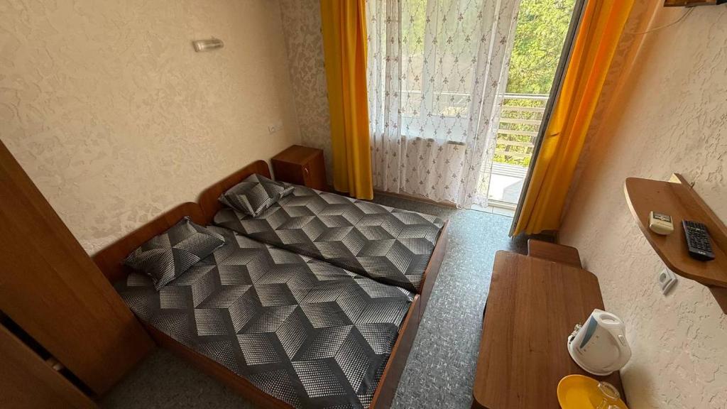 Postel nebo postele na pokoji v ubytování Ассоль
