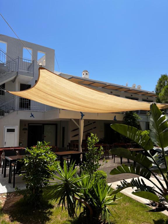 awning over a patio in front of a building at ByAKKAN HOTEL in Bodrum City