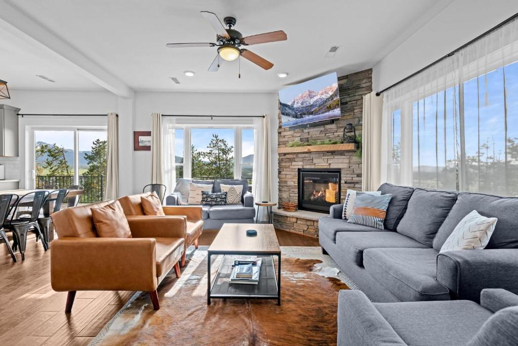 a living room with couches and a fireplace at 838B Wapiti Dr in Fraser