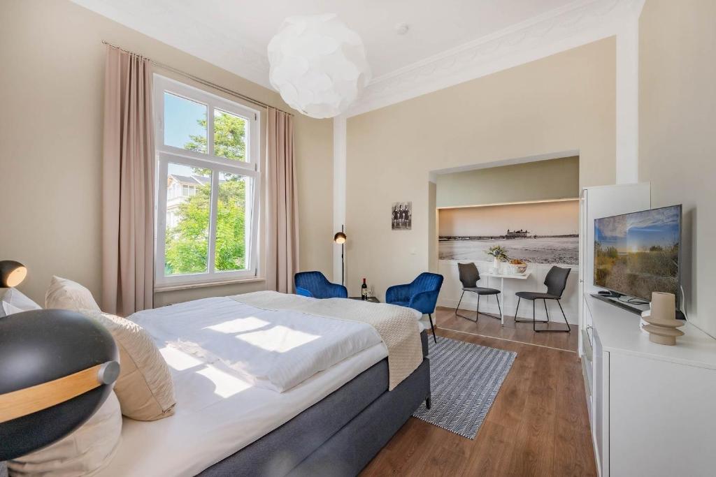 Un pat sau paturi într-o cameră la Villa Carmen Seebrücke