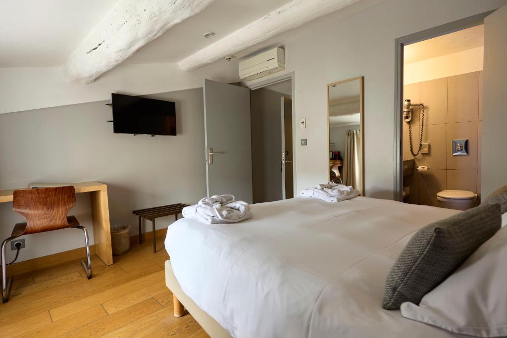 Postel nebo postele na pokoji v ubytování Boutique Hôtel Entraigues