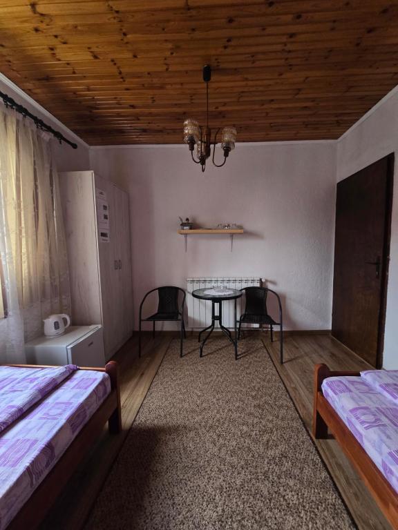 En eller flere senger på et rom på SNAM Rooms&Apartment