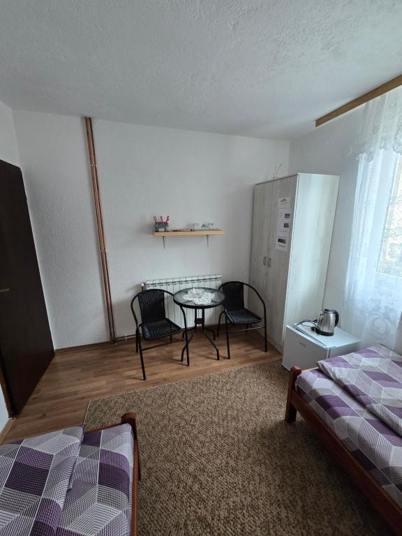 En eller flere senger på et rom på SNAM Rooms&Apartment