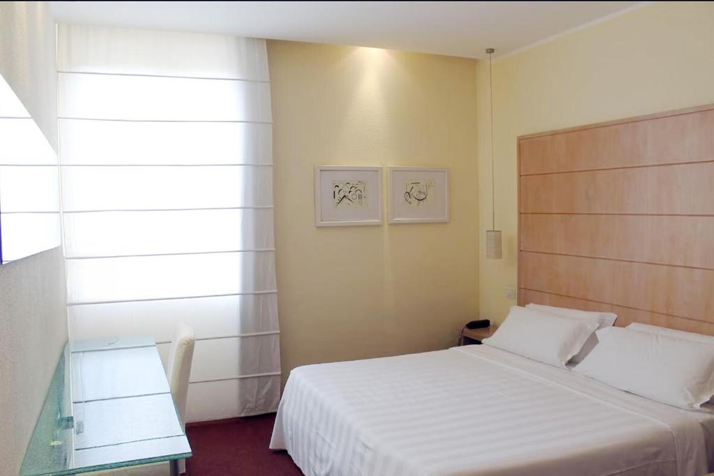 Postel nebo postele na pokoji v ubytování B&B HOTEL First