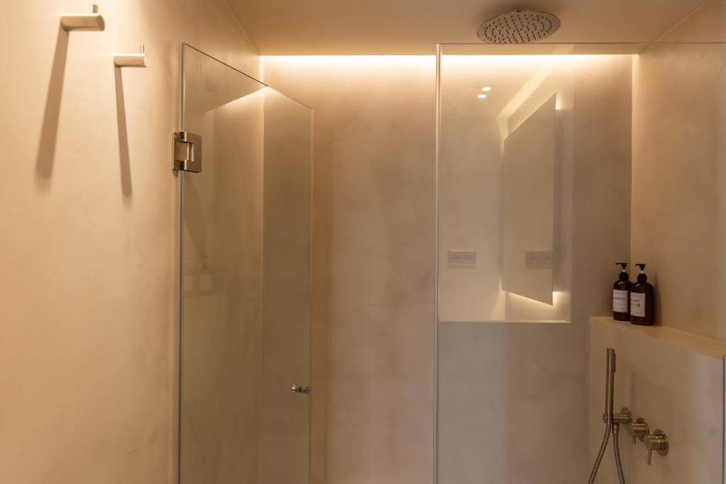 a shower with a glass door in a bathroom at Decô Apartments Barcelona-Born St. in Barcelona