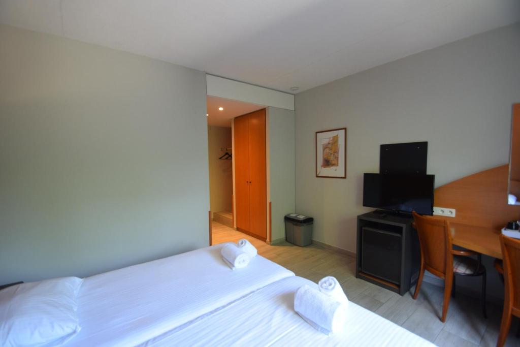 TV a/nebo společenská místnost v ubytování Sleep & Go Brussels Expo Hotel