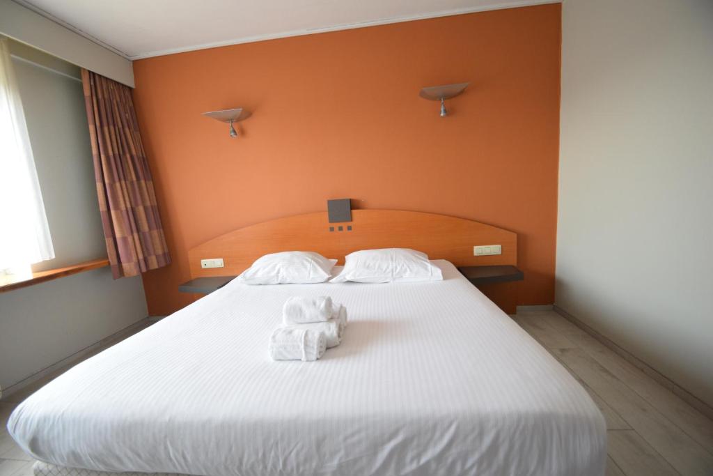 Postel nebo postele na pokoji v ubytování Sleep & Go Brussels Expo Hotel