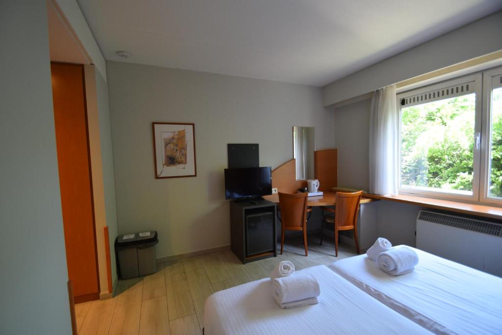 Postel nebo postele na pokoji v ubytování Sleep & Go Brussels Expo Hotel