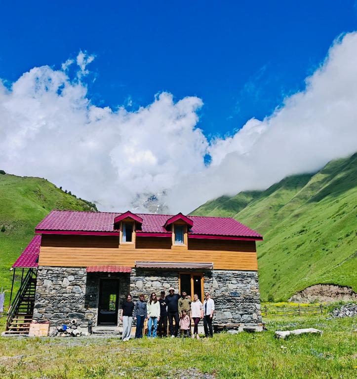 a group of people standing in front of a building at Hotel Arkhoti in Akhieli