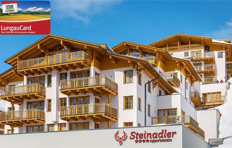 a building with wooden balconies on the side of it at Fewo-Obertauern-Steinadler in Obertauern