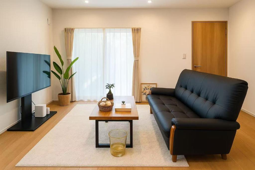 Televiisor ja/või meelelahutuskeskus majutusasutuses 柚子屋 新築貸切戸建旅館