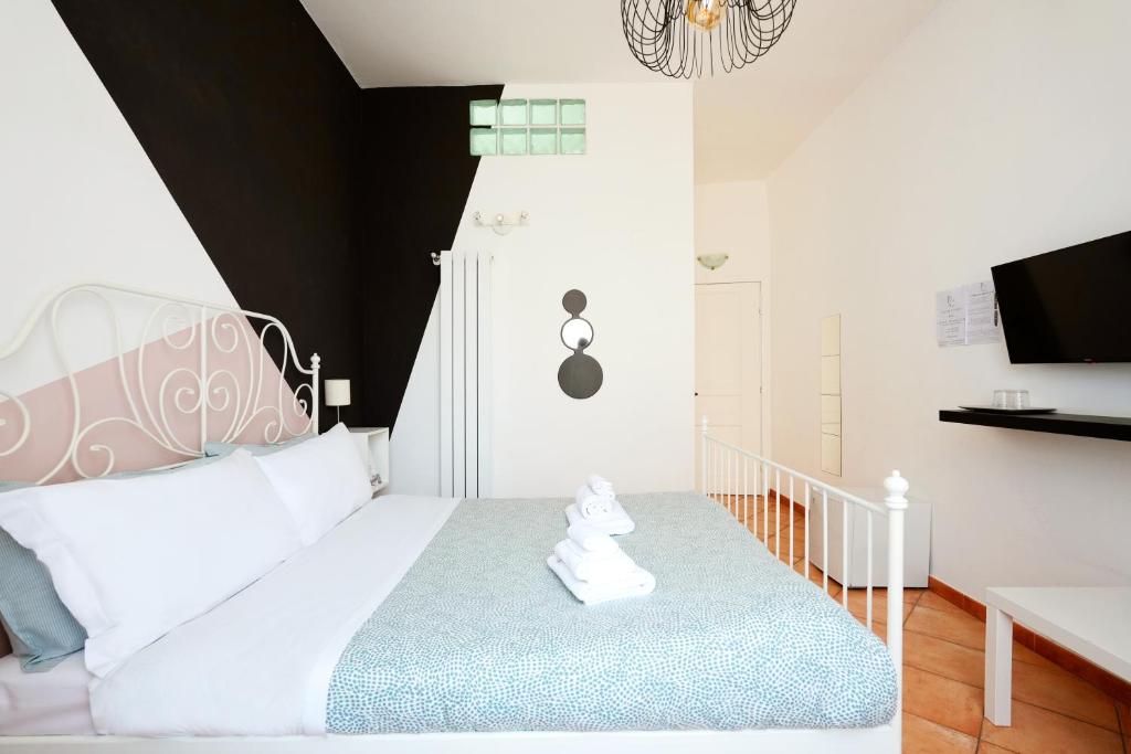 Łóżko lub łóżka w pokoju w obiekcie Palazzo Currò