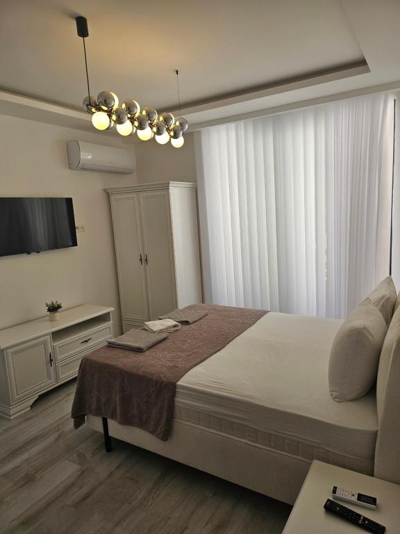 Postel nebo postele na pokoji v ubytování La Vida Apartments