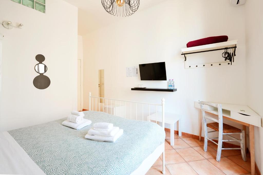 Łóżko lub łóżka w pokoju w obiekcie Palazzo Currò