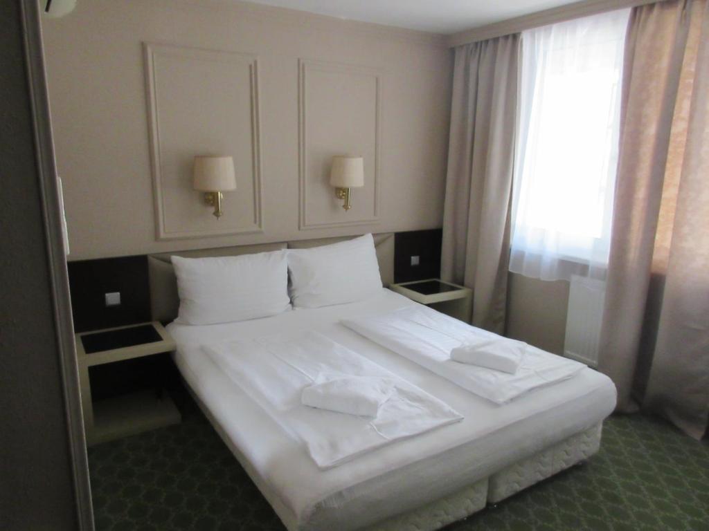 Postel nebo postele na pokoji v ubytování Hotel Attaché l contactless check-in