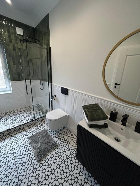 Kúpeľňa v ubytovaní Apartamenty Toszeckie LUX