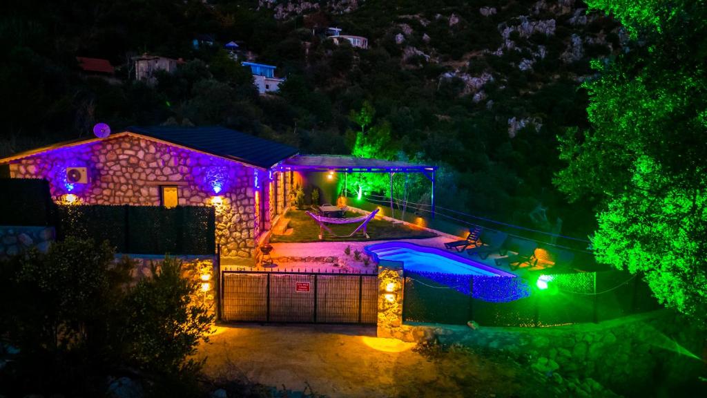 an image of a house at night with lights at VillaVista07 in Kaş