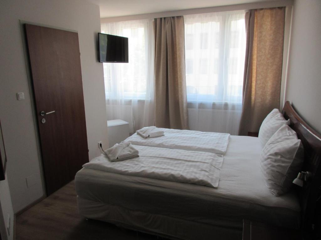 Postel nebo postele na pokoji v ubytování Hotel Attaché l contactless check-in