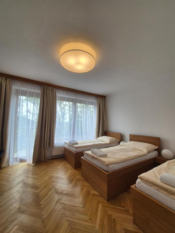 Voodi või voodid majutusasutuse Vilas & Wellness Resort Orlík toas