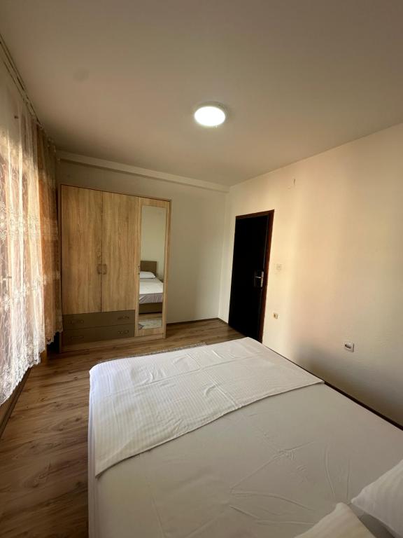 a bedroom with a large white bed in a room at Lea Apartment in Struga