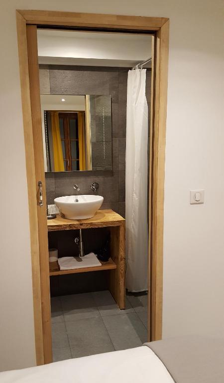 Koupelna v ubytování Hotel Du Clocher