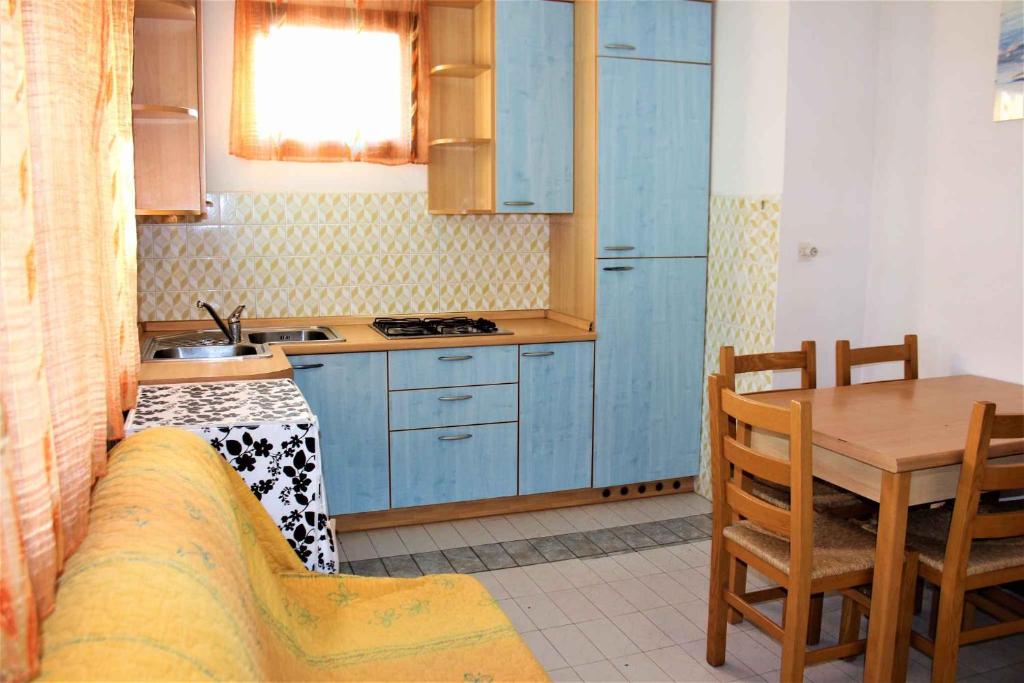 Kuchyňa alebo kuchynka v ubytovaní Apartment in Rosolina Mare 25073