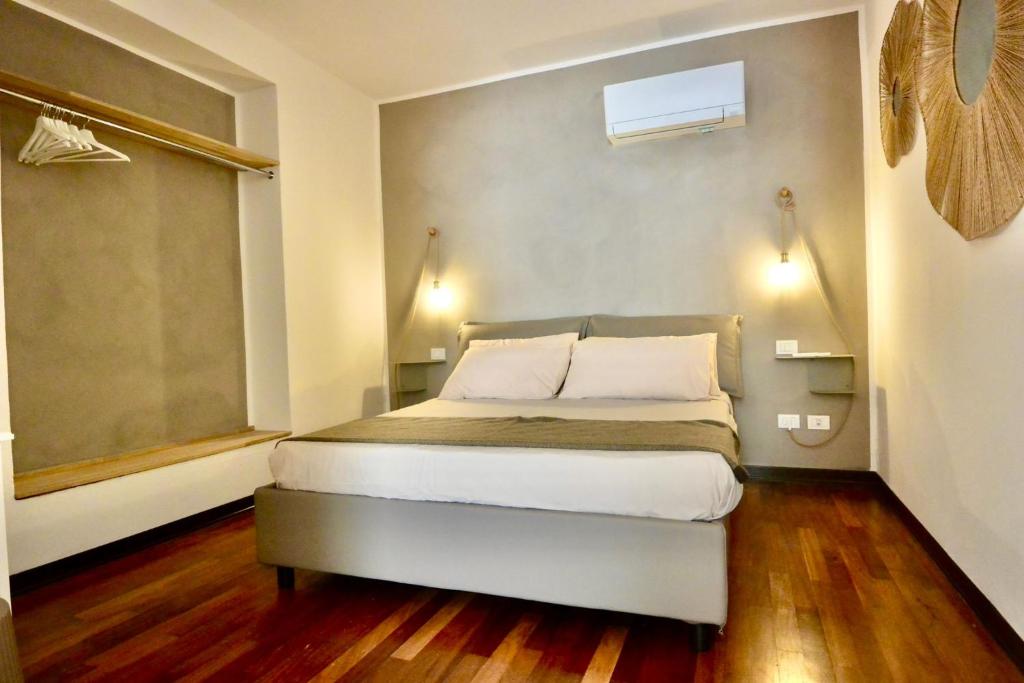 Postel nebo postele na pokoji v ubytování Cala Prodani Rooms