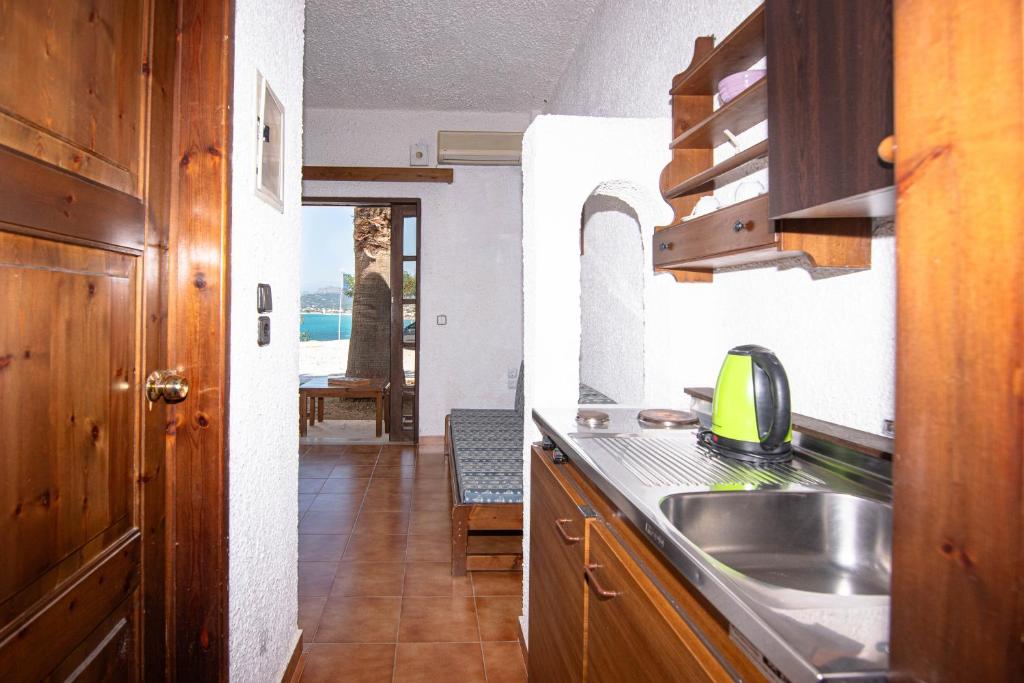Kuchyň nebo kuchyňský kout v ubytování Delfini Apartments