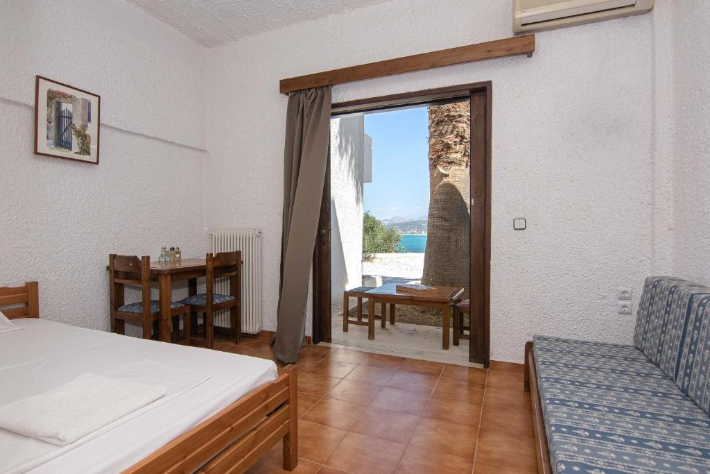 Postel nebo postele na pokoji v ubytování Delfini Apartments