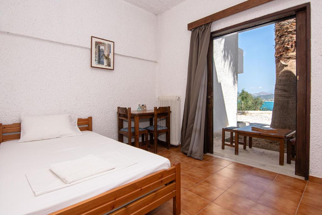 Postel nebo postele na pokoji v ubytování Delfini Apartments