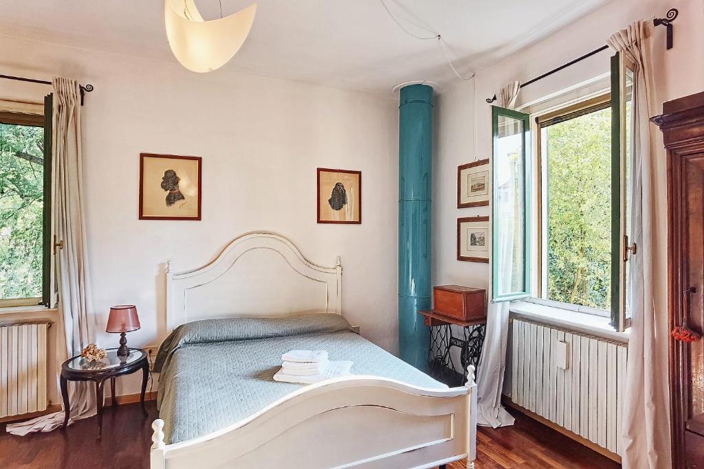 Postel nebo postele na pokoji v ubytování B&B Due Fiumi 1908