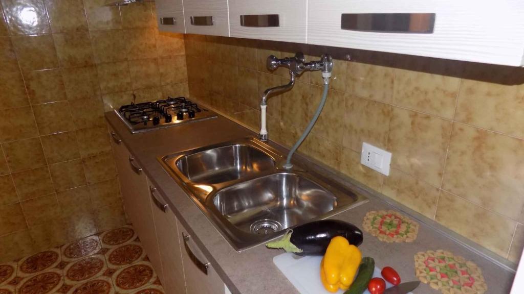 Kuchyň nebo kuchyňský kout v ubytování Apartment in Eraclea Mare 25654