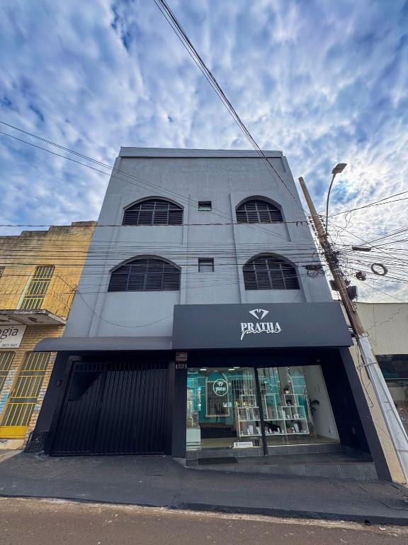 a store front of a building on a street at Menezes Flat in Rio Verde