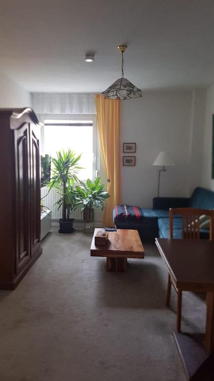 a living room with a couch and a table at Wohnung am Hauptmarkt! in Nuremberg