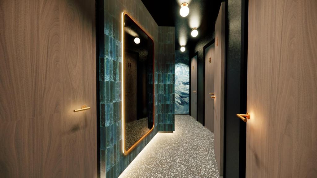 a hallway with a mirror and a narrow hallway at Hotel Indigo Leeds by IHG in Leeds