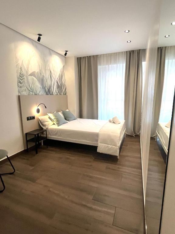 Cama o camas de una habitación en Rooms&Go