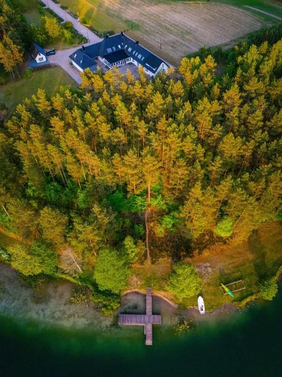 an overhead view of a cross in front of trees at Las Apartamenty - z pomostem i prywatnym dostępem do jeziora in Borowy Młyn