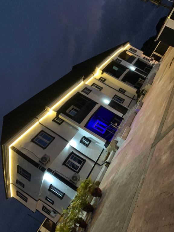 a building with lights on the side of it at Richj luxury apartment in Benin City