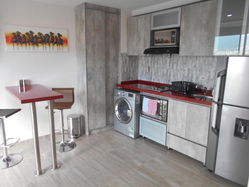 Η κουζίνα ή μικρή κουζίνα στο Laureles 16th floor stylish Spring City Treat