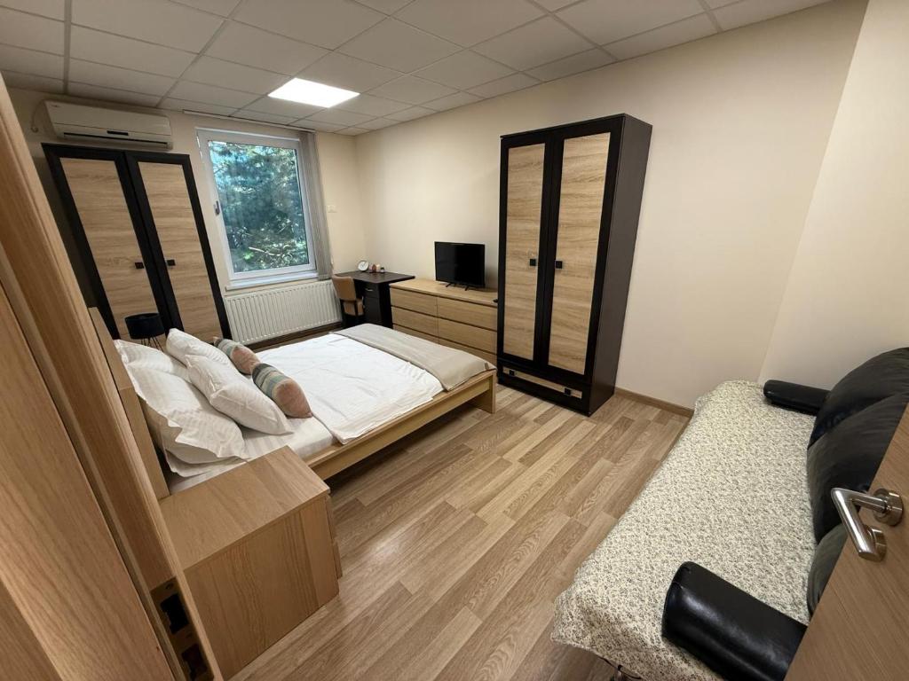 a bedroom with a bed and a mirror at Home Sweet Home - Apartament central 2 camere in Craiova