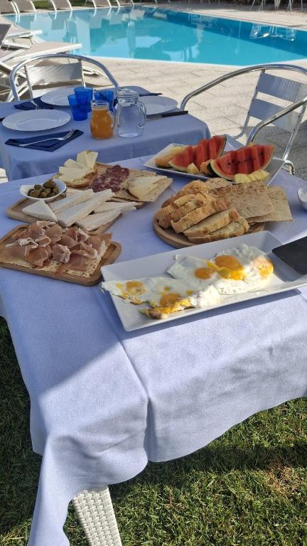 a blue table with food on top of it at Al Mare da Francesca in Olbia