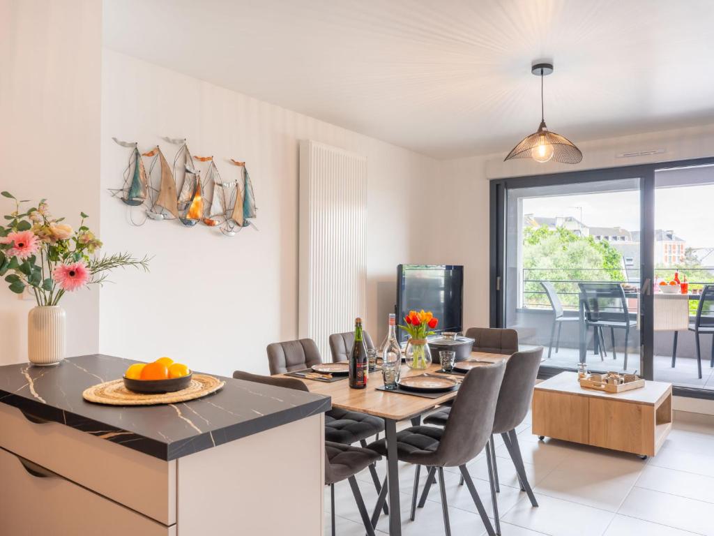 a kitchen and dining room with a table and chairs at Apartment Chasse Marée by Interhome in Quiberon