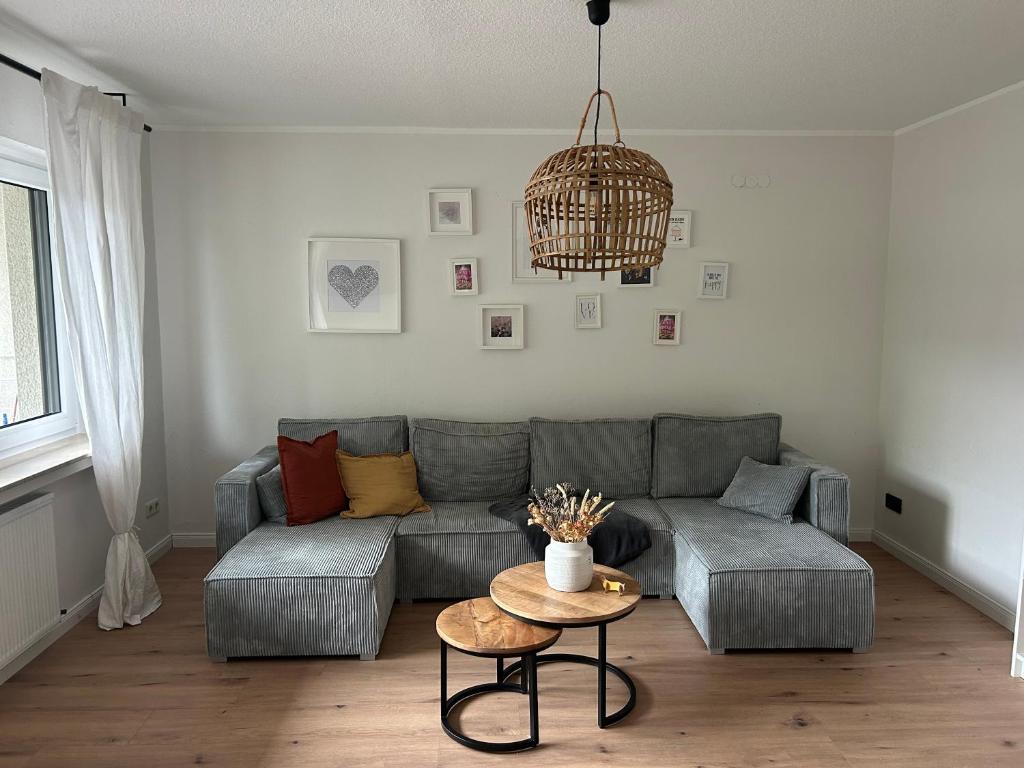 a living room with a couch and a table at Ferienwohnung Theodor - Wandern am Biggesee in Attendorn