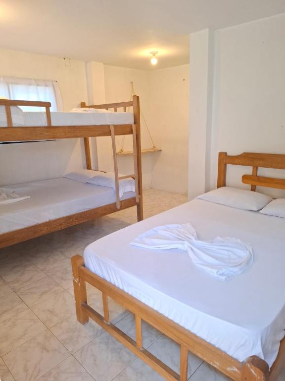 Ένα ή περισσότερα κρεβάτια σε δωμάτιο στο Borealis Apartahotel Tolú