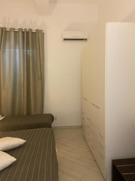 Postel nebo postele na pokoji v ubytování EMOZIONI
