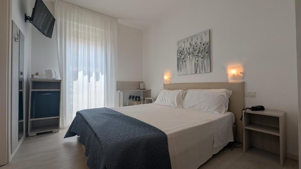 Postel nebo postele na pokoji v ubytování Hotel Villa Anthea