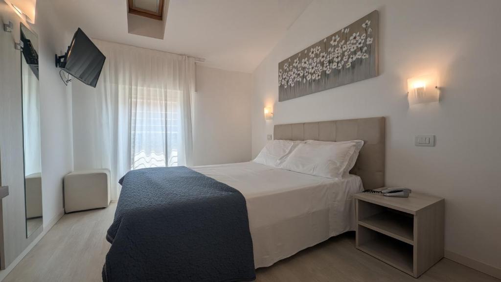 Postel nebo postele na pokoji v ubytování Hotel Villa Anthea