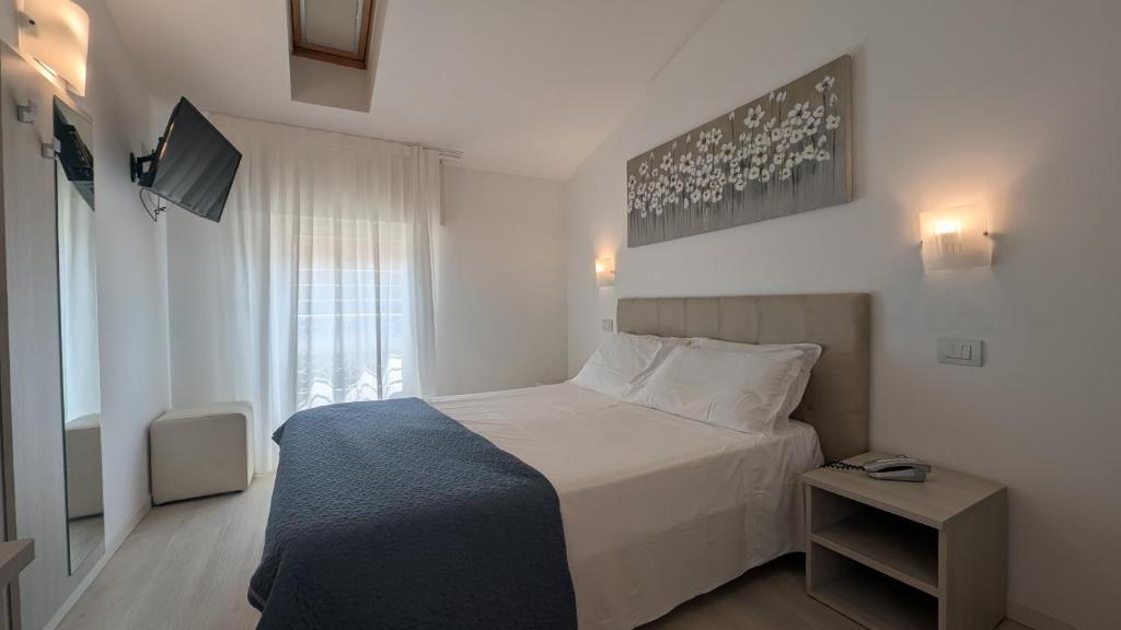 Postel nebo postele na pokoji v ubytování Hotel Villa Anthea