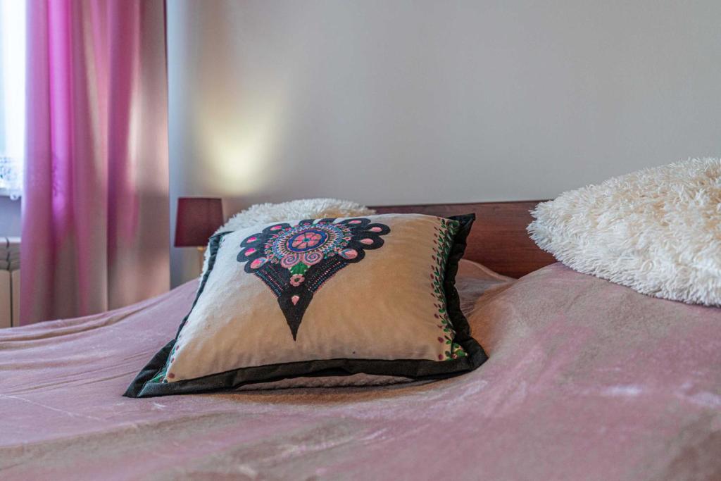 Posteľ alebo postele v izbe v ubytovaní Apartamenty Kluśka