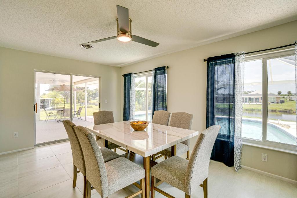 a dining room with a table and chairs at Casa Mar Van Beautiful Property with Heated Pool and Spa minutes to beaches and golf in Rotonda West